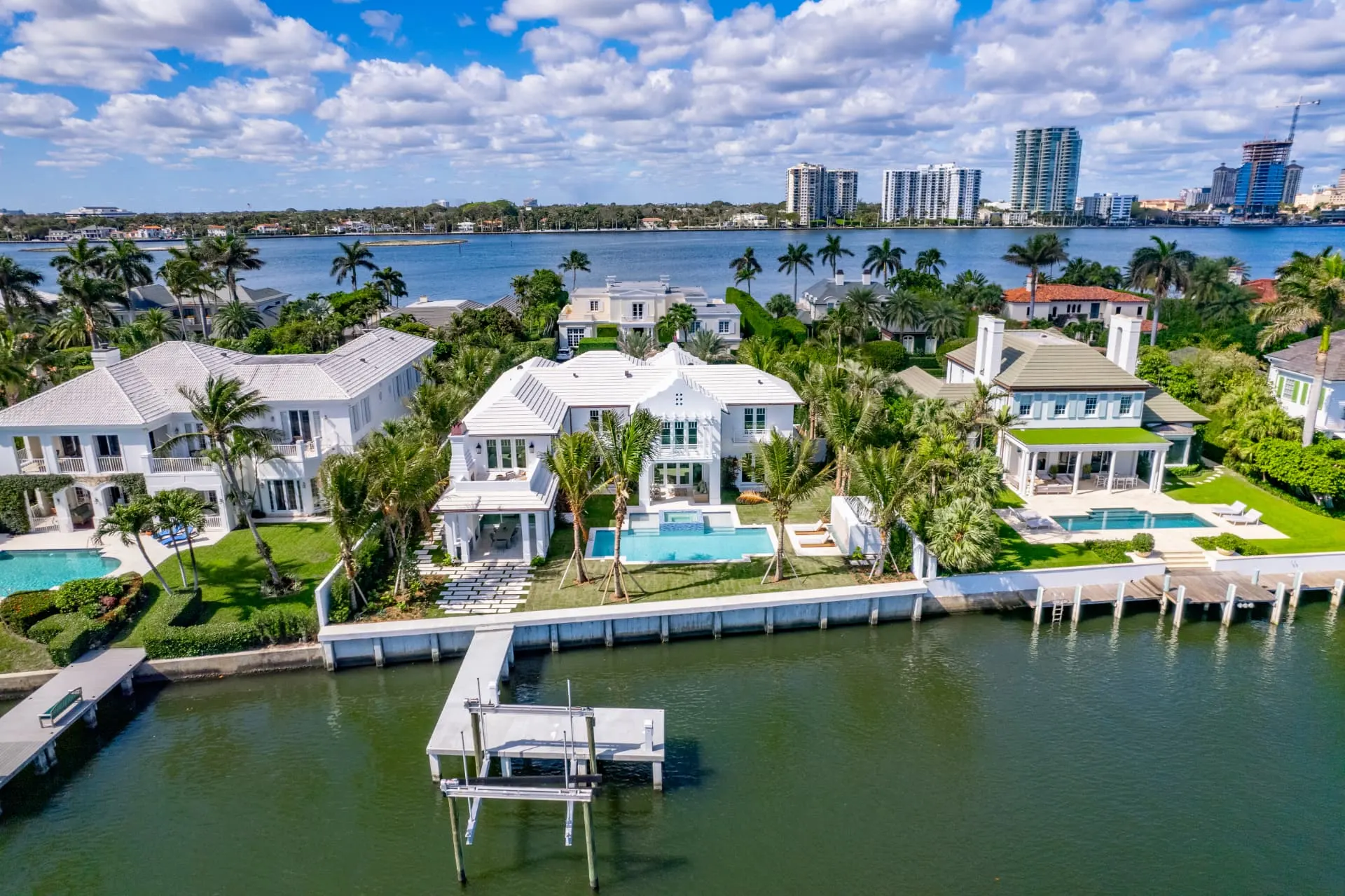 Aerial view of a waterfront Sabatello custom estate with pool and dock on the Intracoastal